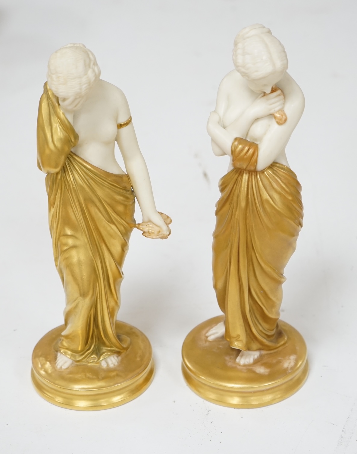 A pair of Royal Worcester porcelain figures, Joy and Sorrow, modelled by James Hadley, 2/57 & 2/47, 24cm. Condition - good